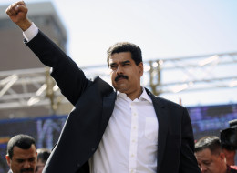 Venezuelan President Nicolas Maduro raises his fist during a rally in Caracas on November 12, 2013. Venezuela's ruling party eyed a vote Tuesday to pave the way for Maduro to govern by decree, broadening his powers, during an inflationary crisis a month before crucial municipal elections.  (Photo: Leo Ramirez/AFP/Getty)