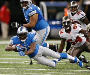 Reggie Bush #21 of the Detroit Lions dives for extra yards against the Tampa Bay Buccaneers on November 24 at Ford Field in Detroit.