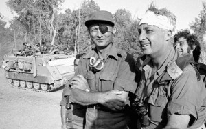 Ariel Sharon (R), recovering from a head injury, with Moshe Dayan on the western side of the Suez Canal in October 1973