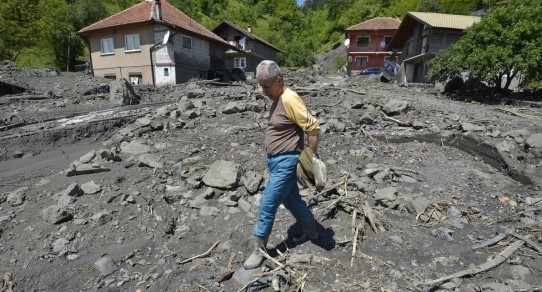 Torrential rain has triggered hundreds of landslides, like here in the Bosnian village of Topcic Polje.