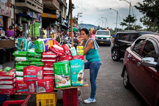 A vendor sells diapers from Venezuela on the street in Cúcuta, Colombia. "Everything you see on this street is Venezuelan," says Alejandro Valbuena, a 32-year-old merchant.