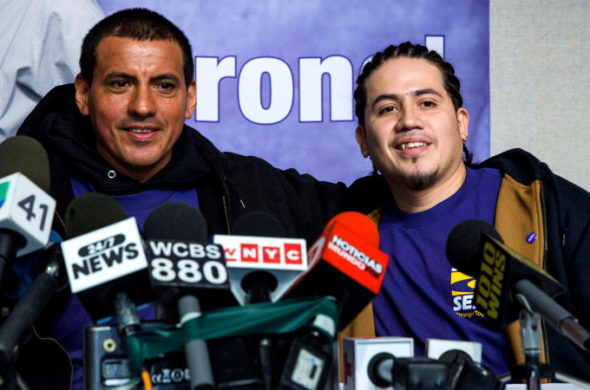 Window washers Juan Lopez and Juan Lizama take part in a news conference to recount their rescue from a malfunctioning scaffold on the side of One World Trade Center a day before in New York