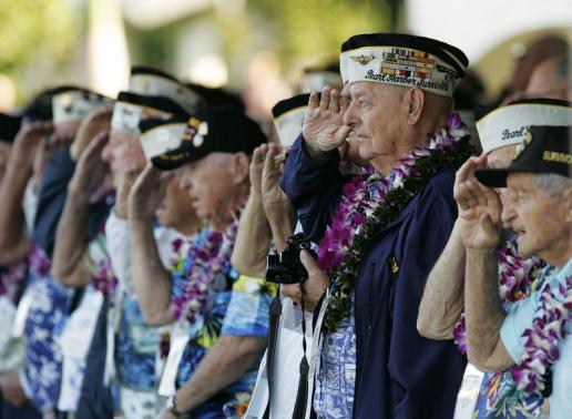Louis Conter a USS Arizona survivor and other Pearl Harbor survivors salute as the USS Chung-Hoon passes by during ceremonies honoring the 73rd anniversary of the attack on Pearl Harbor at the World War II Valor in the Pacific Nat