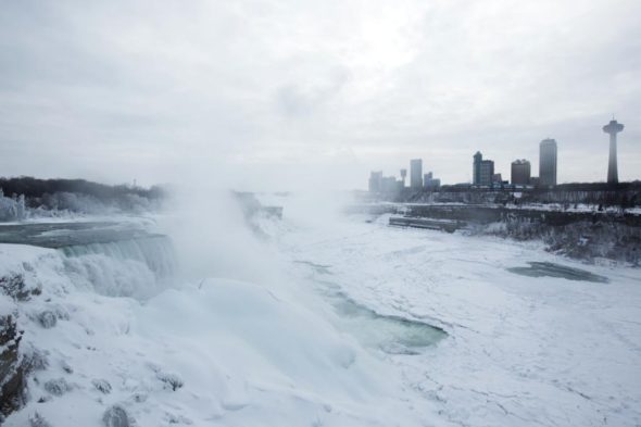 A snow-covered landscape is seen over the frozen Niagara Falls in Niagara Falls, New York February 17, 2015.  Temperatures dropped to 6 degrees Fahrenheit (-14 Celsius) on Tuesday and the National Weather Service issued a Wind Chill Warning in Western New York from midnight Wednesday to Friday.  Picture taken February 17, 2015.  REUTERS/Lindsay DeDario 