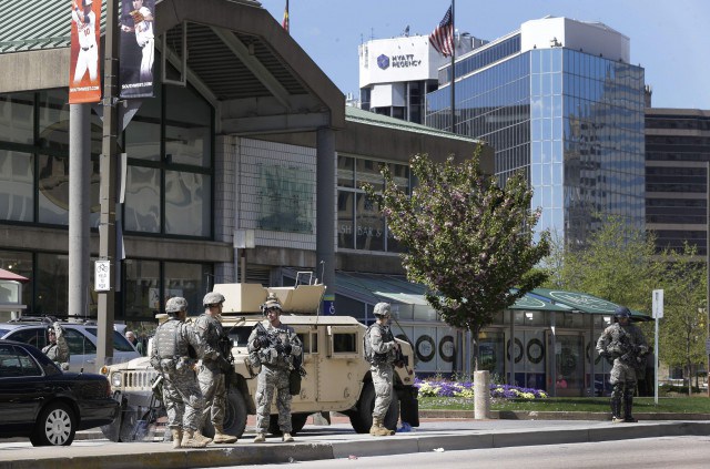 Maryland National Guardsmen patrol near downtown businesses in Baltimore, Tuesday, April 28, 2015, a day after looting and arson erupted.  (AP Photo/Patrick Semansky)