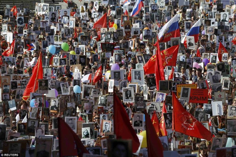 Around 500,000 people marched through central Moscow with portraits of their relatives who fought in WWII. President Putin surprised Russians by unexpectedly joining the mammoth procession on Red Square, a portrait of his veteran father Vladimir in his hand.