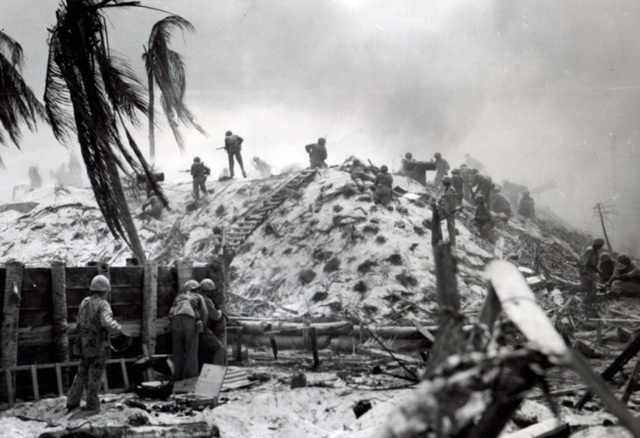 Knoxville native Marine 1st Lt. Alexander "Sandy" Bonnyman, Jr., stands atop the bunker where he was killed during the battle of Tarawa on Nov. 22, 1943. Bonnyman, center at the top of the makeshift ladder, was awarded a Congressional Medal of Honor for his bravery. 
