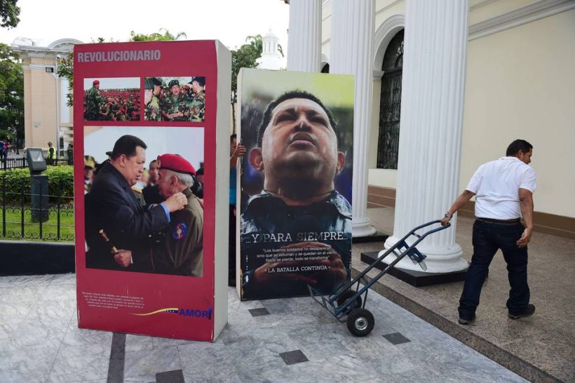 National Assembly employees removed pictures of the late President Hugo Chavez from the legislative building in Caracas on Wednesday. Venezuela's opposition has broken the government's long grip on the legislature. 