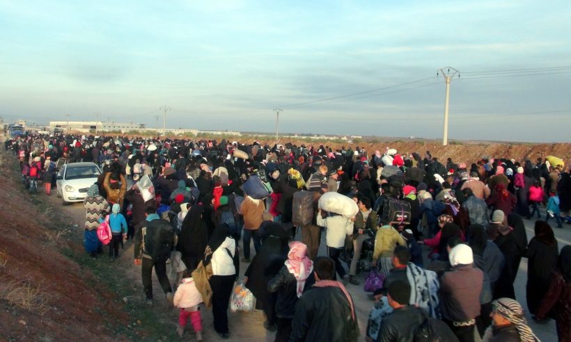 Syrians make their way to the Esselame border gate, in the Turkish province of Kilis, as they flee airstrikes in and around Aleppo. (Photo: The Guardian/Anadolu Agency/Getty Images)