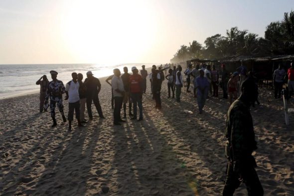 Emergency workers and security officers gathered on the beach after an attack in Grand Bassam, Ivory Coast.