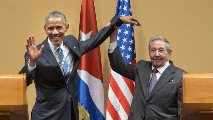 Raúl Castro lifts up President Obama's arm at the conclusion of Monday's joint news conference at the Palace of the Revolution in Havana. 