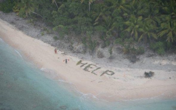 Stranded sailors signal for help on tiny uninhabited Pacific island of Fanadik.