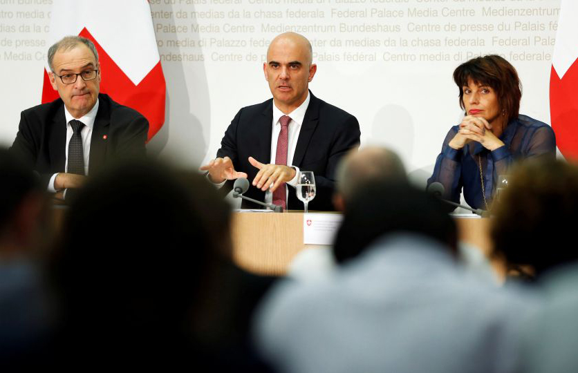 Swiss Defence Minister Guy Parmelin (L-R), Interior Minister Alain Berset and Energy Minister Doris Leuthard attend a news conference following the vote results in Bern September 25, 2016.