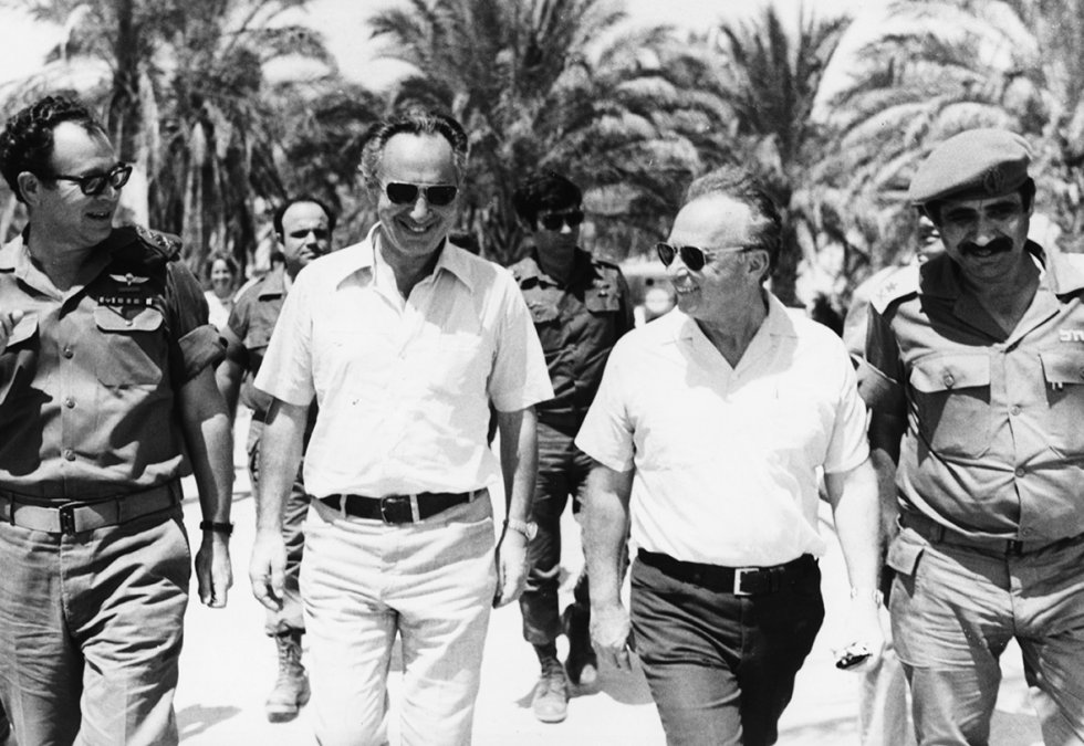 June 1967: Israeli Prime Minister Yitzhak Rabin (second right) walks with Shimon Peres (second left) and Mordechai Gur (left), and Deputy Chief of Staff General Yekutiel Adam (right) during a tour of the forces on the Egyptian Front in Sinai during the Six Day War. 