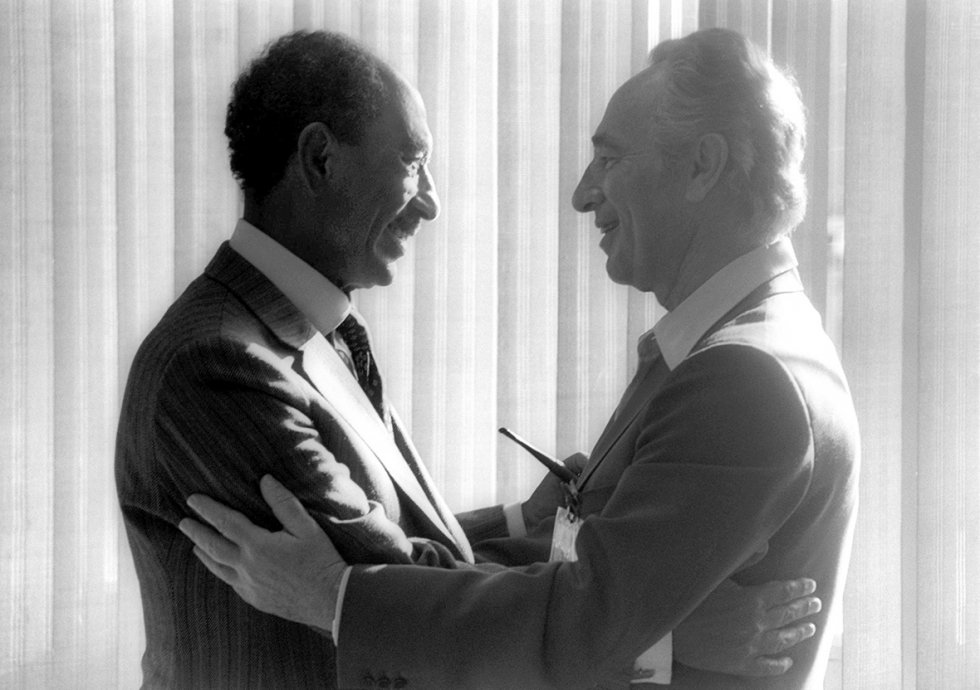 May 25, 1979: Egyptian President Anwar Sadat greets then Israeli opposition leader Shimon Peres in the southern Israeli city of Beersheva. Two months earlier, Israel and Egypt had signed their historic peace treaty, making Egypt the first Arab nation to recognize the Jewish State