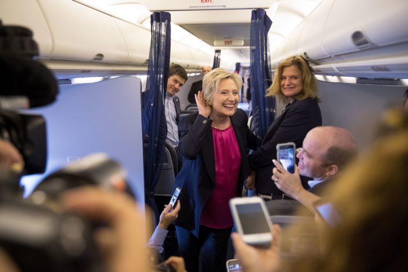 Hillary Clinton, accompanied by traveling press secretary Nick Merrill, left, and director of communications Jennifer Palmieri, right, Sept. 6, 2016. (AP Photo/Andrew Harnik)