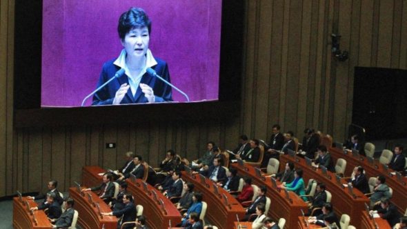 South Korean President Park Geun-hye, shown on a large screen, delivers a speech at the National Assembly in Seoul, South Korea, Monday, Oct. 24, 2016. (AP Photo/Ahn Young-joon)