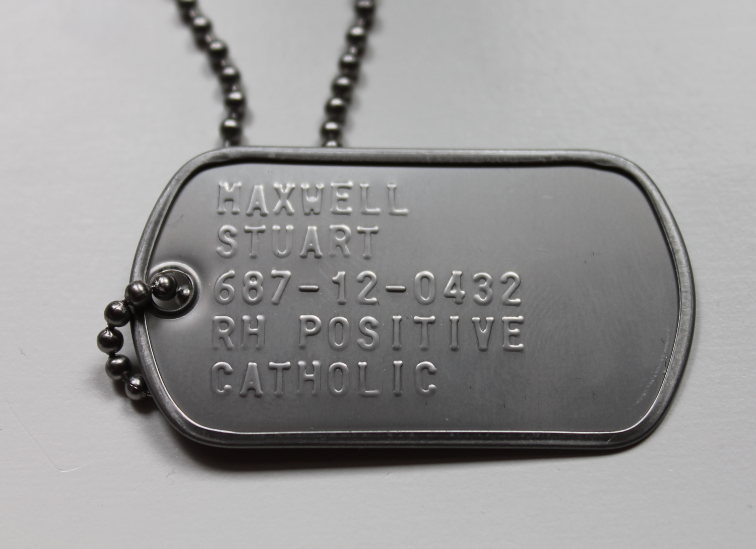 What information should be on a dog tag
